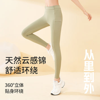 Juyitang seamless high waist hip slimming side pocket anti-curling high elastic nude yoga pants Lycra motorcycle pants.